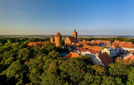Panorama of the city of Reszel at sunrise, Castle and the Church